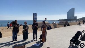 street band playing instruments on Barcelona beach